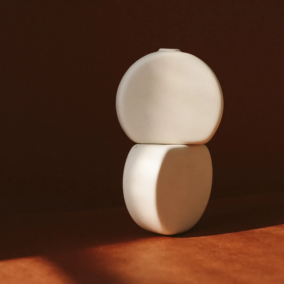 Minimal ceramic vase glowing in warm afternoon light
